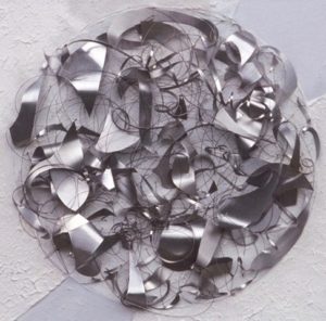 Silver sphere from strings and shards of metal