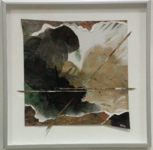A framed art with hues of black, brown, and white