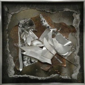 Art depicting silver metallic shards on a rusty background